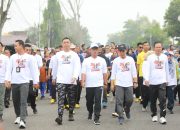 Bupati Ardito Hadiri Jalan Sehat Hari Bhayangkara Ke-79 Di Taman Tugu Canang Lampung Tengah